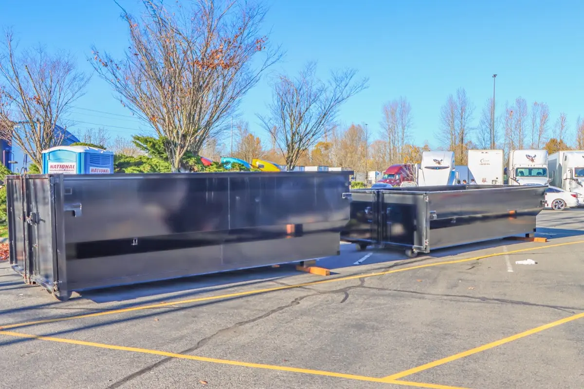 Professional dumpster rental service with roll-off container on residential driveway in Briar Chapel